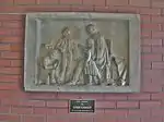 Panel from original Gallaudet monument (1854) depicting Thomas Hopkins Gallaudet teaching children the manual alphabet