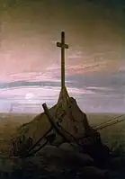 The Cross Beside The Baltic (1815), 45 × 33.5&nbsp;cm. Schloss Charlottenburg, Berlin. This painting marked a move away from depictions in broad daylight, to return to nocturnal scenes, twilight and a deeper poignancy of mood.