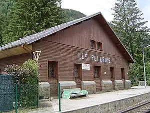 Wooden two-story building with gabled roof