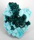Dioptase on Chrysocolla, Otjikotu, Kunene Region, Namibia. 6.8 × 5.5 × 4.5 cm