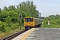A Merseyrail Class 507 departs towards Liverpool.