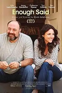 The film poster features a photo of a bearded, balding white man in a grey t-shirt and a brunette woman in a dotted dress shirt. Both are sitting on a stoop and smiling, with the primary cast and title &quot;Enough Said&quot; above them. Under the title, &quot;Written and directed by Nicole Holofcener&quot; is visible. At the bottom, the poster's billing block can be seen.