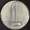 General Motors 25th anniversary medal, 1933, featuring teardrop shaped car