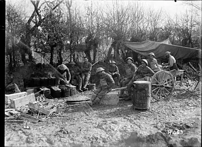 H463. Maori Pioneers await their evening meal on the Somme, 1 April 1918. Photo: Henry Armytage Sanders