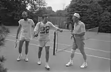 Gerald Ford, Donald Rumsfeld, and David Kennerly following a tennis match on the court in 1976