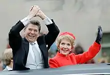 U.S. President Ronald Reagan and wife Nancy Reagan waving from the limousine during the inaugural parade in Washington, D.C. (1981)