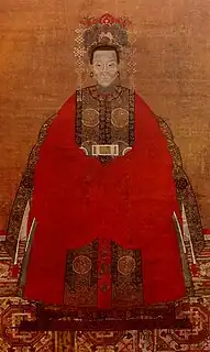 Qing dynasty lady in a red robe and xiapei over shoulders.