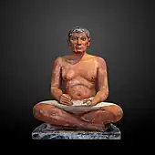 The Seated Scribe; 2613–2494 BC; painted limestone and inlaid quartz; height: 53.7 cm