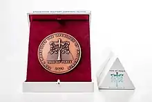 A Plaque with a decorative box (etui).