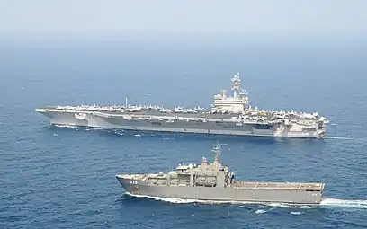 USS George H.W. Bush underway with RSS Endeavour in the Arabian Sea on 15 November 2011.