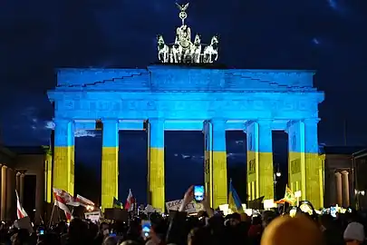 The Brandenburg Gate lit up in the colors of the Ukrainian flag during a solidarity protest on 24 February 2022