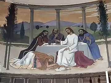 Détail de la fresque du chœur montrant Madeleine essuyant les pieds de Jésus avec ses cheveux après les avoir parfumés