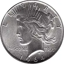 Pièce de monnaie représentant le profil gauche d'une femme aux cheveux longs, portant une couronne et les inscriptions LIBERTY, IN GOD WE TRUST ET 1964.