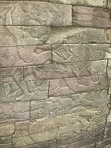 Coup de pied délivré à un démon, bas-relief à Banteay Chhmar Angkor aux alentours du XIIIe&nbsp;siècle