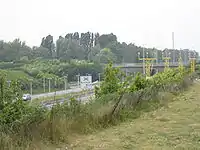 Début de l'autoroute au niveau de l'échangeur de Courtrai-Ouest.