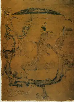 Gentilhomme chevauchant un dragon qui porte aussi une grue de bon augure. Un poisson les accompagne. Encre sur soie. IIIe siècle, 37,5 × 28 cm. Changsha Musée provincial, Hunan.
