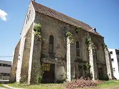 Façade est, avec les portes d'accès à l'atelier d'héliogravure actuel.