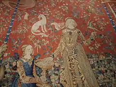 Chèvre à la droite de la Dame du Goût, et une perruche à collier sur sa main