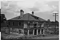 Vue d'une maison abandonnée de la plantation en 1938