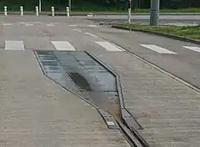 Une plaque de droppage installée au terminus d'Essey Mouzimpré.