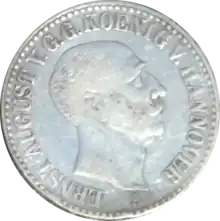 Portrait d'un homme sur une pièce de monnaie.