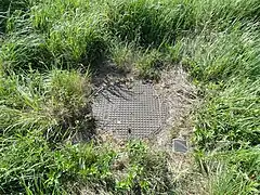 La tête de puits matérialisée.