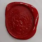 Cachet de cire rouge de Blaise Pascal représentant un ciel rayonnant, enfermé dans une couronne d’épines et portant sur le pourtour la devise en latin, "Scio cui credidi"