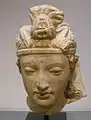Tête de bodhisattva. Hadda. IVe ou Ve&nbsp;siècle. National Gallery of Victoria - Asian art. Melbourne, Australie.