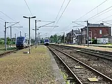 ...avant d'atteindre la gare de Serqueux, terminus de la ligne, mais qui offrait des correspondances vers Rouen, Amiens, Dieppe ou Paris...