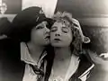 Avec Gloria Swanson (à g.), dans Her Decision (1918)