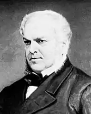 Détail en N et B d'un tableau. Forster, ami et premier biographe de Dickens, 60 ans environ, visage épais, cheveux blancs, regard sévère et perçant