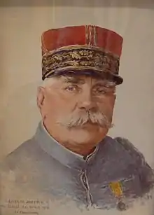 Portrait d'un homme moustachu et un képi rouge.
