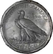Une pièce de monnaie représentant un aigle, debout sur une branche et les inscriptions United States of America, E Pluribus Unum et Twenty Dollars.