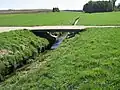 Petit pont d'un chemin paysan passant sur la rivière à côté du lieu-dit Mont Tessin.