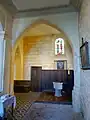 1re&nbsp;grande arcade du sud, vue dans la chapelle des fonts baptismaux.