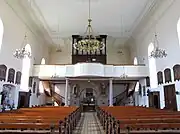 Vue intérieure de la nef vers la tribune de l'orgue Geib-Rinckenbach (1826-1907).