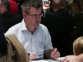 Nicolas Doucet lors d'une dédicace au Salon du livre et de la famille en 2015.