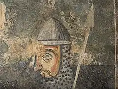 Scène avec un soldat avec le haume et la lance.