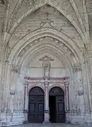 Portail ouest (1577), par Hugues le Rupt.