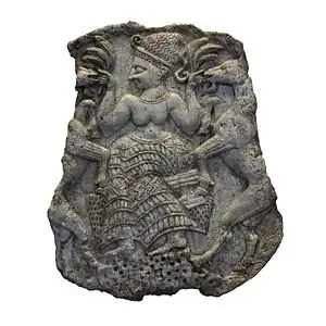 Couvercle de pyxide décoré d'une déesse nourrissant des caprins. Minet el-Beida, XIIIe&nbsp;siècle&nbsp;av. J.-C. Musée du Louvre.