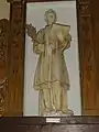 Statue de Saint-Étienne, patron de la paroisse.