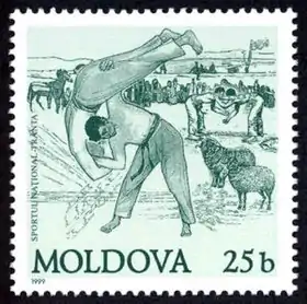 Timbre Sportul Național Trânta, de 1999, de la République de Moldova, d'une valeur de 25&nbsp;bani.