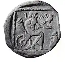 Drachme judéenne de la période perse frappée en Samarie et trouvée à Gaza (Ve&nbsp;siècle&nbsp;av. J.-C.). Divinité Yahu assise sur une roue ailée et tenant un faucon. Inscription YDH : Yehud (« Judée »).